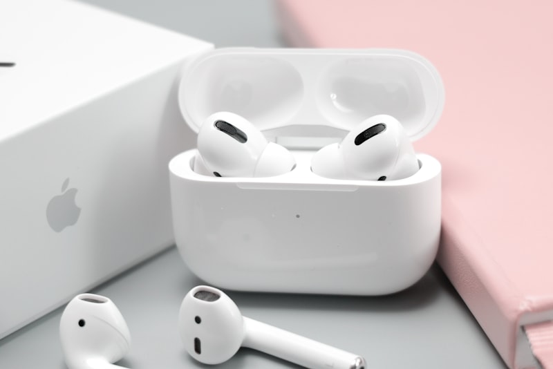 Wireless earbuds beside a phone